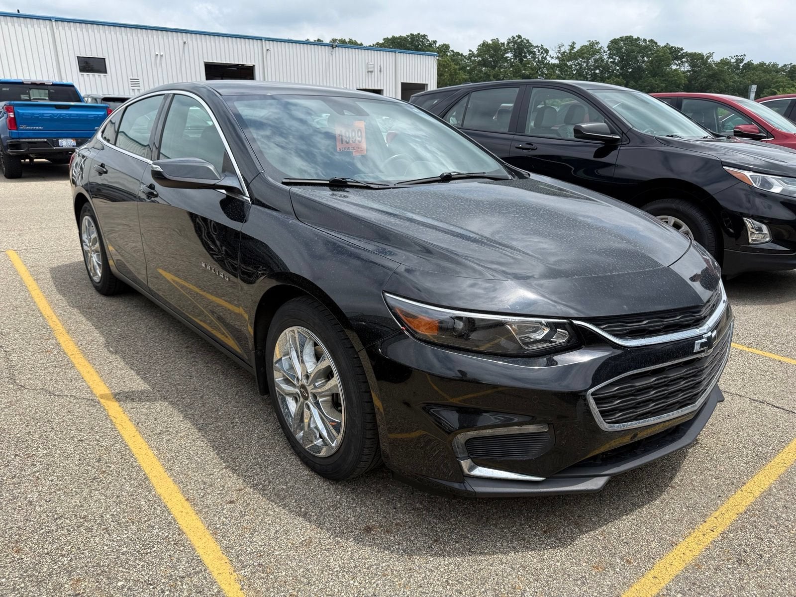 2016 Chevrolet Malibu Hybrid in Mosaic Black Metallic — front three-quarter view