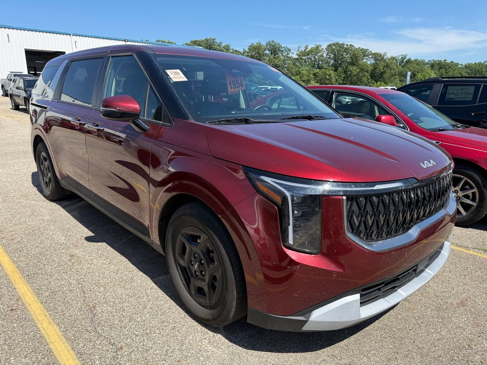 2026 Kia Carnival LXS in Other — front three-quarter view