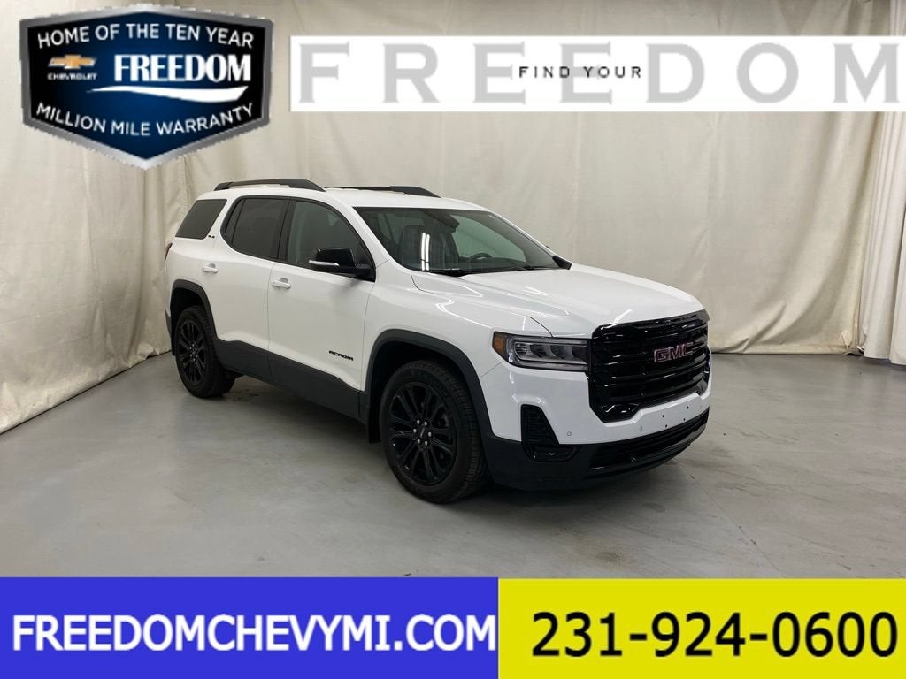 2023 GMC Acadia SLE in Summit White — front three-quarter view