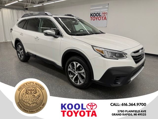 2021 Subaru Outback Touring in Crystal White Pearl — front three-quarter view